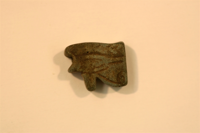 Udjat-eye amulet from grey-brown faience